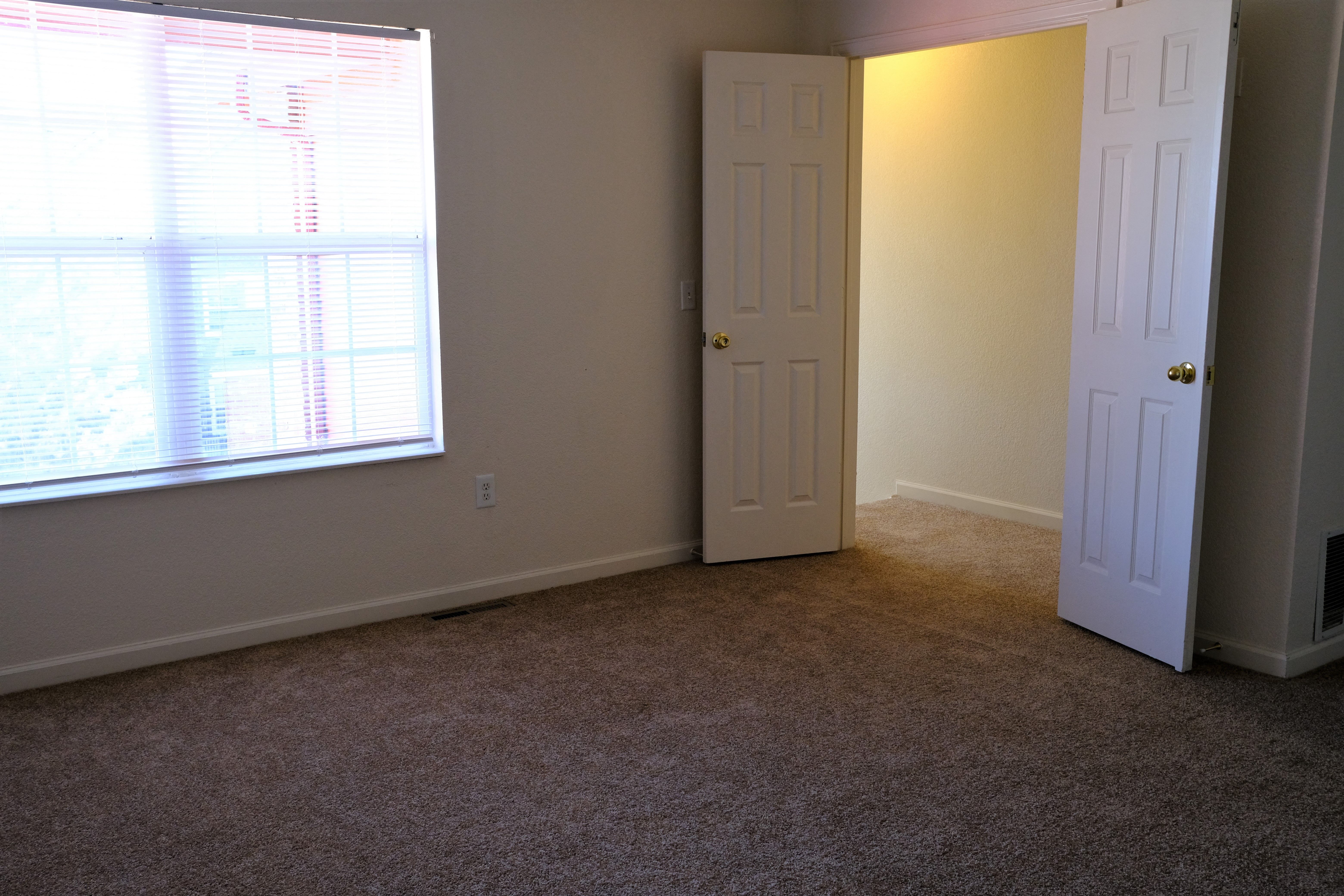 Upper level master bedroom with French doors
